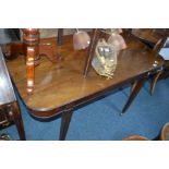 A GEORGIAN MAHOGANY D END DINING TABLE SECTION, on square tapering legs and brass casters, width