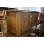 A REPRODUCTION CARVED OAK BLANKET CHEST