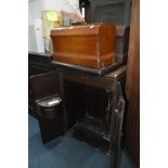 TWO CASED TABLE TOP SEWING MACHINES and a treadle sewing machine in an oak cabinet, 54cm width x