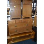A STAG MINSTREL GOLDEN OAK CHEST OF FOUR SHORT AND TWO LONG DRAWERS and a pair of bedside cabinets