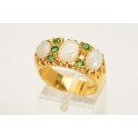 AN 18CT GOLD OPAL AND EMERALD RING, designed as three graduated oval opals, the central opal flanked