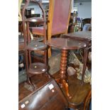 AN EDWARDIAN MAHOGANY THREE TIER FOLDING CAKE STAND together with a Victorian mahogany circular