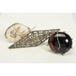THREE BROOCHES, the first a late Victorian oval banded agate brooch within a silver claw and bead