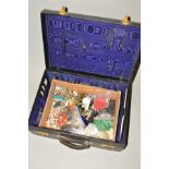 A VINTAGE SUITCASE WITH COSTUME JEWELLERY, to include paste necklaces, broken necklaces etc and a