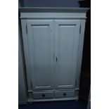 A CREAM PAINTED DOUBLE DOOR WARDROBE above two drawers, width 119cm x depth 55cm x height 192cm