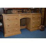 A PINE DRESSING TABLE with a seperate swing mirror above five various drawers, width 168cm x depth