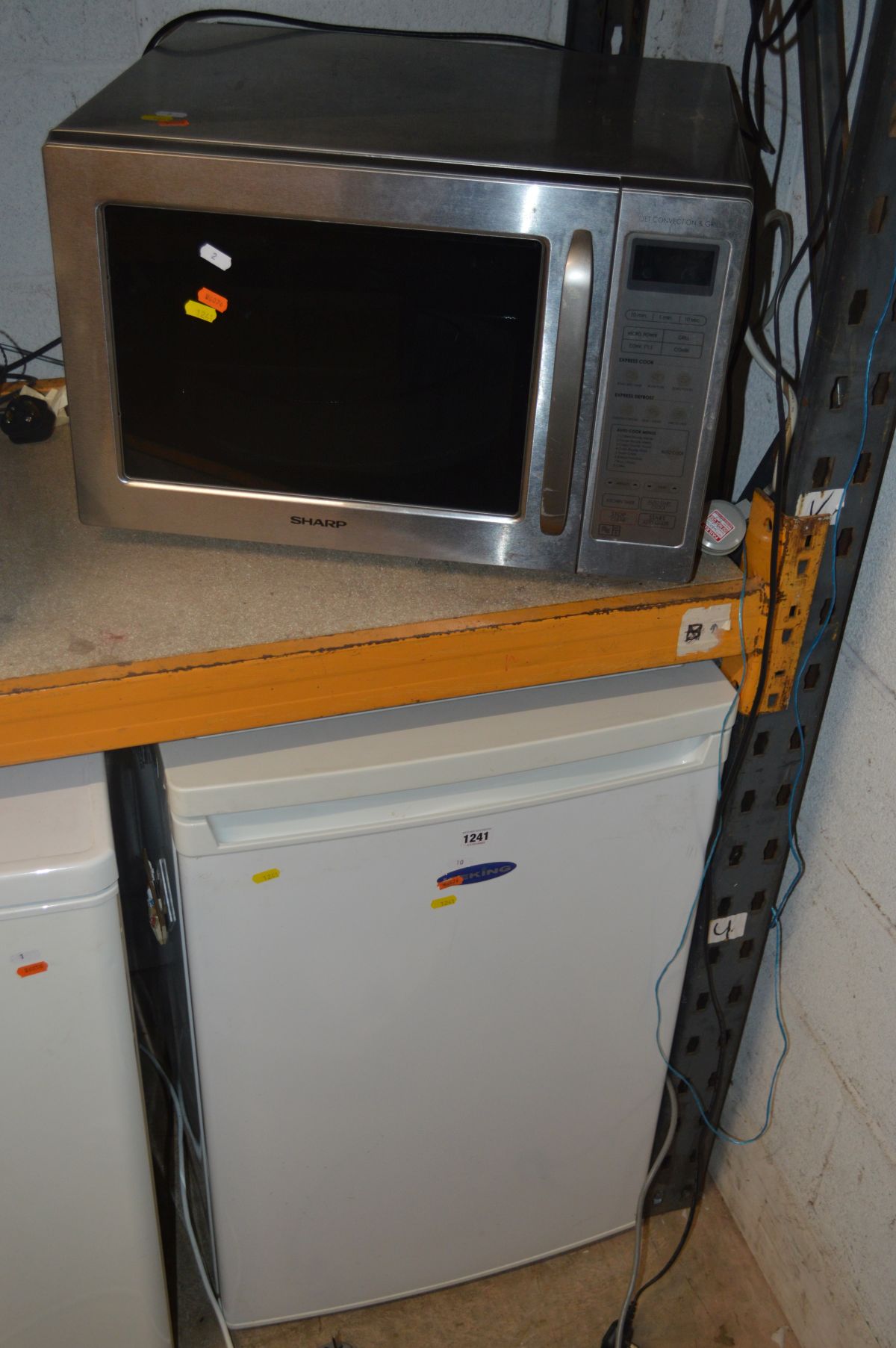 AN ICE KING UNDERCOUNTER FRIDGE together with a Sharp microwave (2)