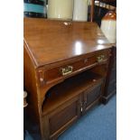 A EDWARDIAN MAHOGANY FALL FRONT BUREAU with one drawer an open shelf and two doors below, width 97cm