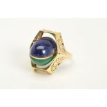 A GEM SET SWIVEL RING, designed as a central oval swivel panel set to one side with a sodalite