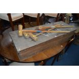 AN EDWARDIAN PINE CASED CASSIOBURY CROQUET SET, comprising of seven mallets, hoops, balls, etc