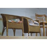 A PAIR OF GILT PAINTED LLOYD LOOM BEDROOM ARMCHAIRS