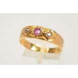 A MID VICTORIAN 18CT GOLD RUBY AND DIAMOND RUBY RING, designed as a central circular ruby within a