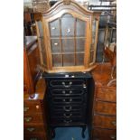 AN EDWARDIAN EBONISED SIX DRAWER MUSIC CABINET, with drop down drawer fronts, brass drop handles,