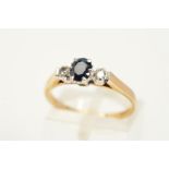 A 9CT GOLD SAPPHIRE AND DIAMOND RING, the central oval cut sapphire within a six claw setting,