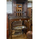 AN EDWARDIAN MAHOGANY FOLD OVER TEA TROLLEY on casters together with a mahogany nest of three