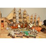 TEN MODELS OF SHIPS ON STANDS, HMS Victory, height 43cm x length 50cm, H M S Bounty height 34cm x