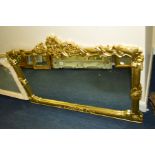 A MODERN FOLIATE GILT WOOD OVERMANTEL MIRROR, 128cm x 87cm