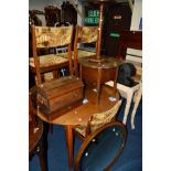 A CIRCULAR EDWARDIAN MAHOGANY CENTRE TABLE together with an oak cased Singer Sewing machine, an