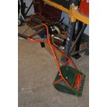 A GREEN AND RED PAINTED VINTAGE SCARIFIER