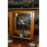 AN EARLY 20TH CENTURY MAHOGANY CASED TOWERS , WIDNES SCIENTIFIC LABORATORY SCALES with glazed sides