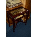A REPRODUCTION MAHOGANY DISPLAY TOP CABINET on square tapering legs united by a cross stretcher with