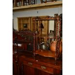 A VICTORIAN WALNUT THREE TIER WHAT NOT with fretwork gallery joined by barley twist uprights,