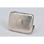 AN EDWARDIAN SILVER CIGAR CASE OF RECTANGULAR FORM, hand hammered finiosh, vacant circular