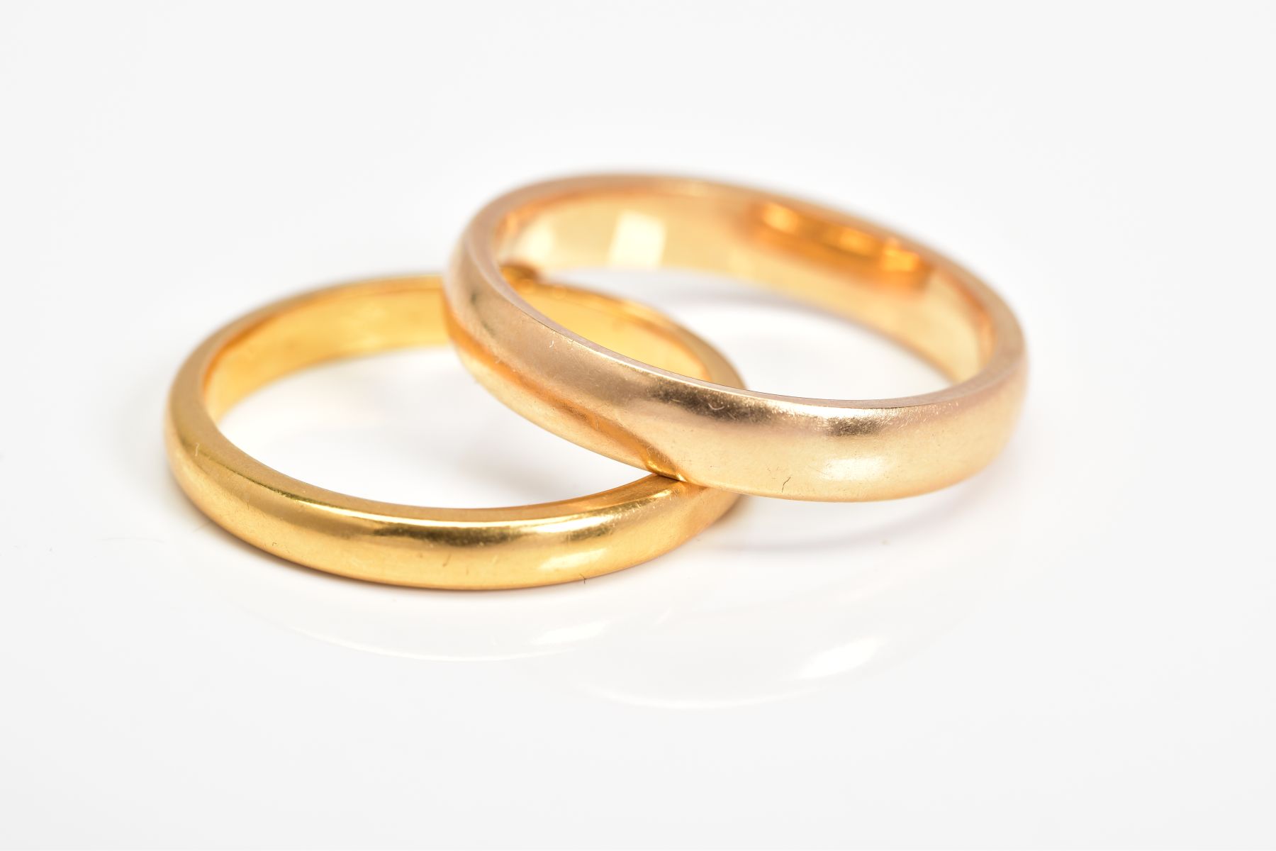 AN 18CT GOLD BAND RING AND A 22CT GOLD BAND RING, both of plain design, both with hallmarks, 18ct