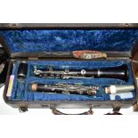 A LATE 19TH CENTURY/EARLY 20TH CENTURY EBONY CASED CLARINET, English made, serial number 142476