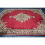 A LARGE AXMINSTER STYLE RED AND CREAM GROUND CARPET SQUARE, Louis De Poortere label attached,
