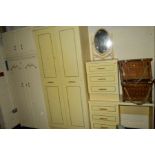 A CREAM THREE PIECE BEDROOM FITMENT, comprising of a double door wardrobe, dressing table and a