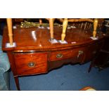 AN EARLY 19TH CENTURY MAHOGANY AND INLAID BOW FRONT SIDEBOARD, fitted with a single drawer above a