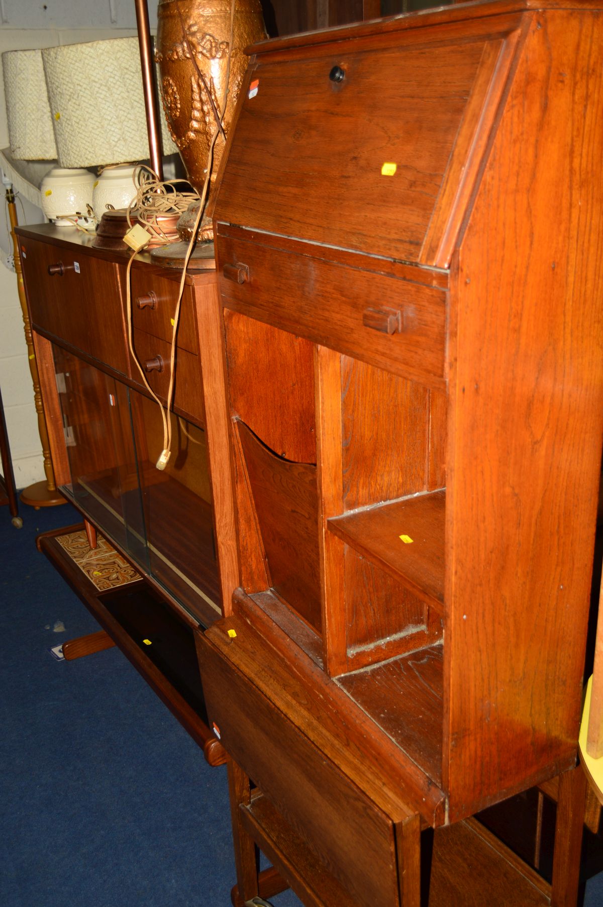 AN AVALON TEAK BOOKCASE with fall front bureau, width 114cm x depth 31cm x height 92cm together with