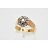 AN 18CT GOLD DIAMOND CLUSTER RING, the tiered cluster with a central brilliant cut diamond in a