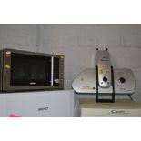 AN E & R CLASSIC ULTRA COMPACT IRONING PRESS together with a Goodmans microwave (2)