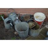 A COLLECTION OF SIX GALVANISED ITEMS to include three buckets, two watering cans, bird feeder etc,