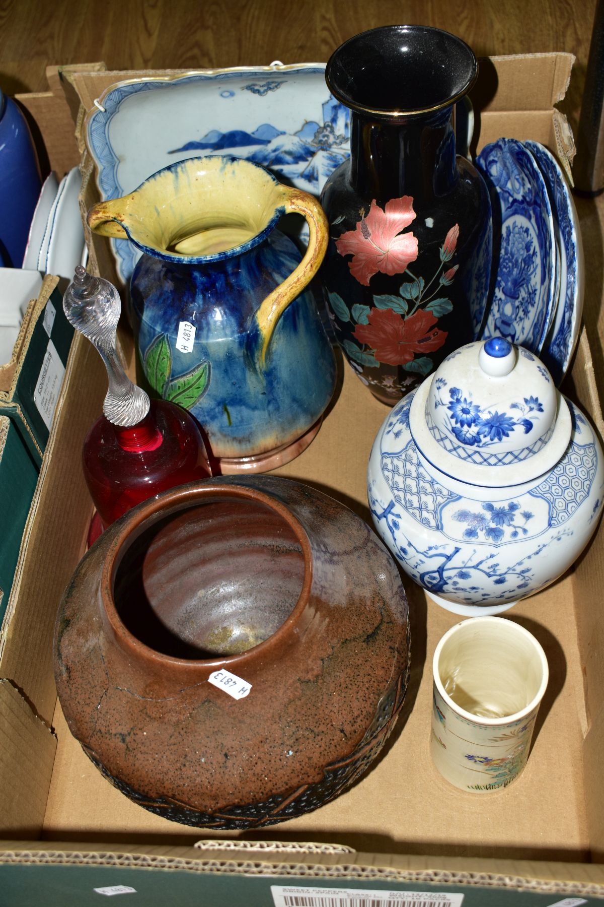 ONE BOX OF CERAMICS AND A CRANBERRY GLASS BELL, to include two Chinese blue and white plates with