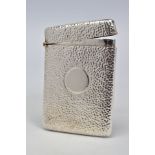 A GEORGE V SILVER RECTANGULAR CARD CASE, hand hammered finish vacant circular cartouche, makers