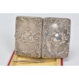 A CASED EDWARDIAN SILVER RECTANGULAR CARD CASE, foliate embossed decoration cartouche with