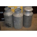 THREE GALVANISED MILK CHURNS one with lid