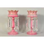 A PAIR OF VICTORIAN PINK OPALINE GLASS LUSTRES, floral and beaded detailing with gilt edging and