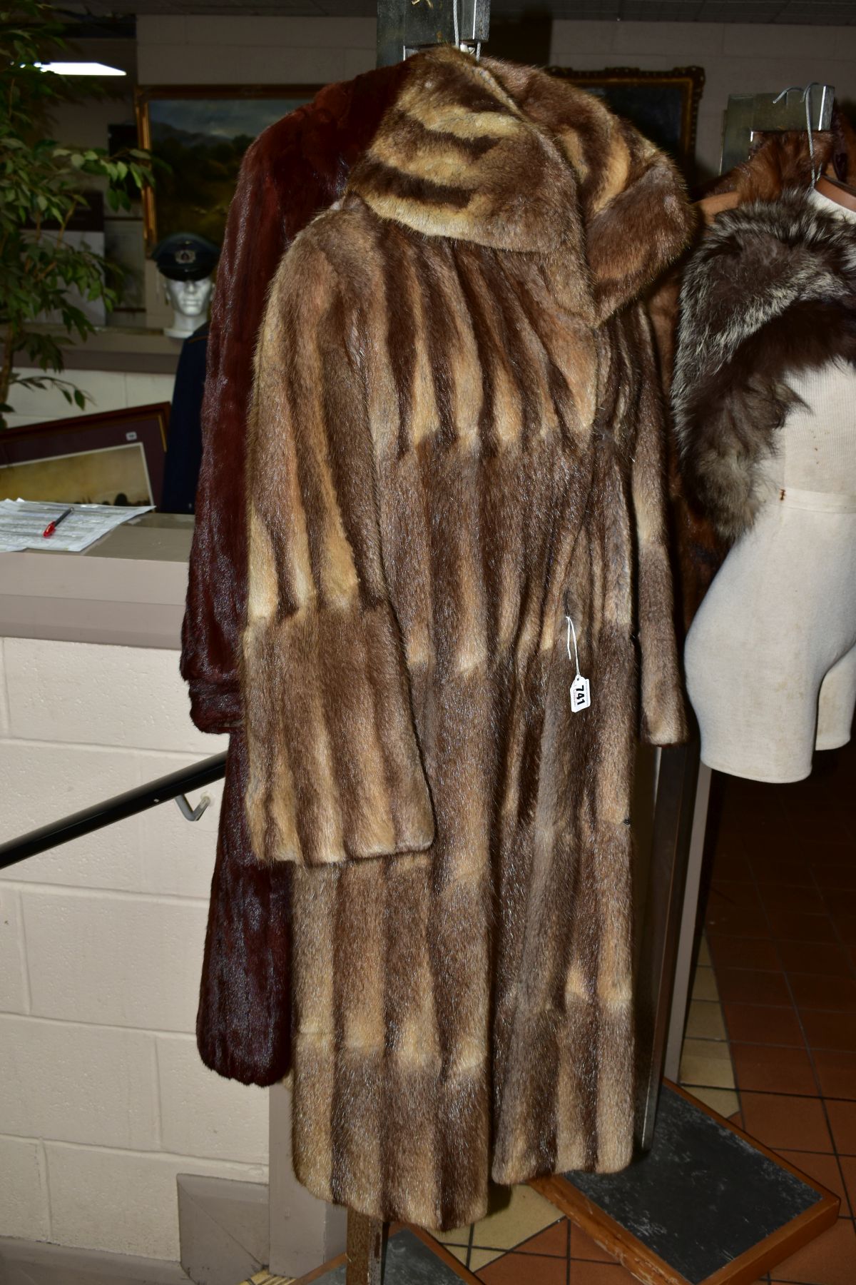 TWO FUR COATS, to include a musquash fur coat with wide lapel collar, four hook fastenings and inner