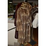 TWO FUR COATS, to include a musquash fur coat with wide lapel collar, four hook fastenings and inner