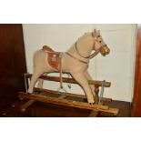 A MAMAS AND PAPAS ROCKING HORSE on a mahogany frame (sd)