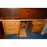 AN EARLY TO MID 20TH CENTURY OAK DESK with six assorted drawers, width 153cm x depth 90cm x height