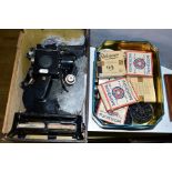 A 'BABY PROJECTOR' c 1920's, with a collection of Pathescope 9.55mm films, some boxed