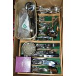 A BOX OF LOOSE CUTLERY, mostly stainless steel