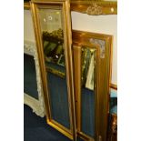 A MODERN RECTANGULAR GILT FRAMED BEVELLED EDGE WALL MIRROR, 45cm x 136cm together with two other