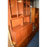 A PAIR OF MID 20TH CENTURY TEAK GLAZED DOUBLE DOOR WALL UNITS/BOOKCASES, together with a low teak