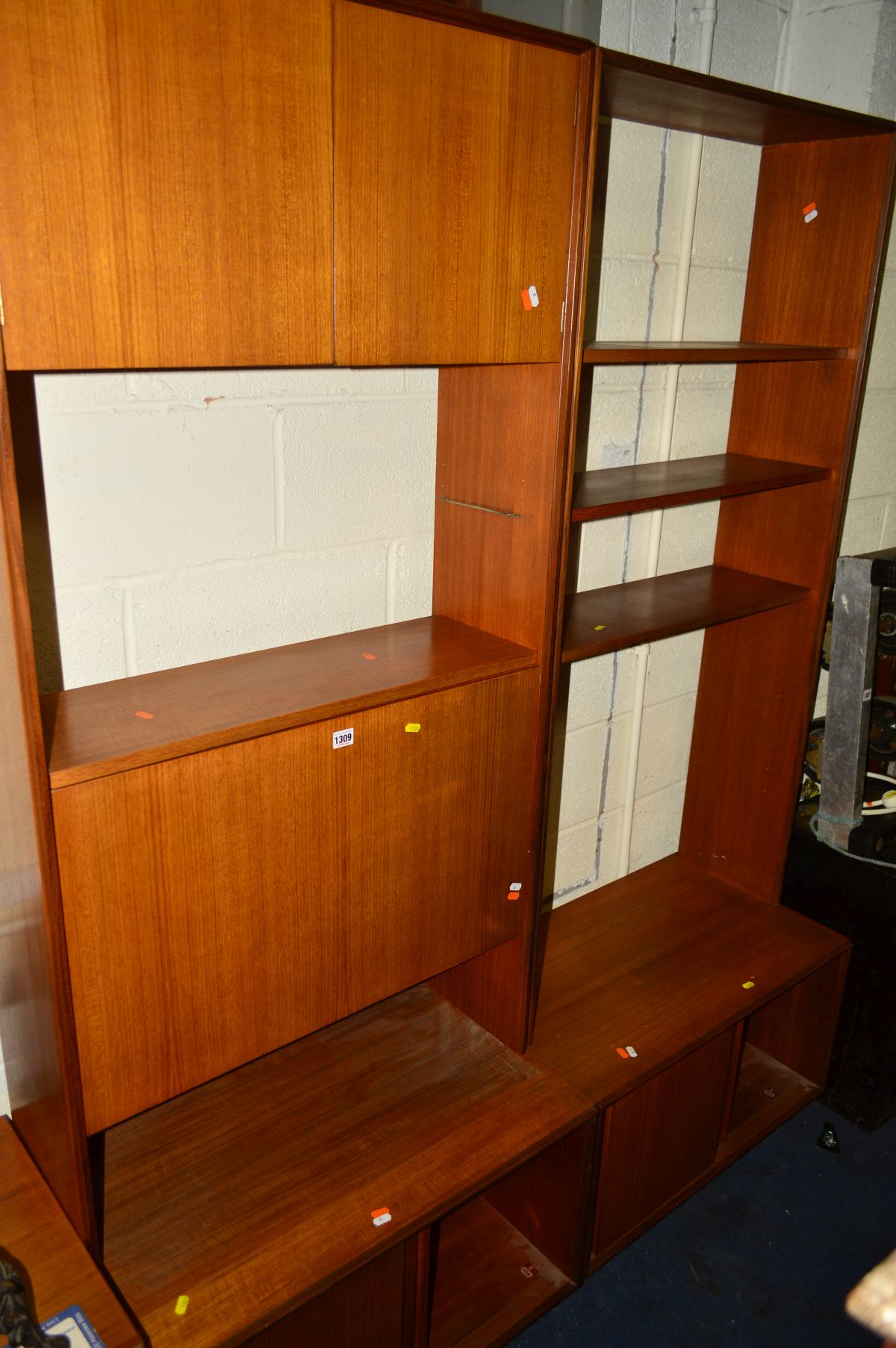 A 1960'S/1970'S G PLAN TEAK TWO SECTION WALL UNIT/BOOKCASE, with various open shelving and cupboards